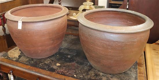 A pair of large glazed earthenware planters Diam.64cm